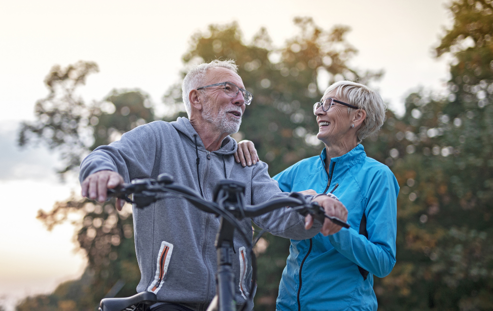 Senior couple biking through Riverside Park in New York