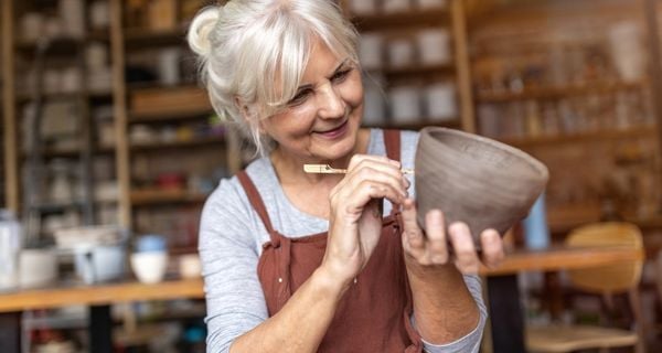 mature woman doing her hobby of pottery