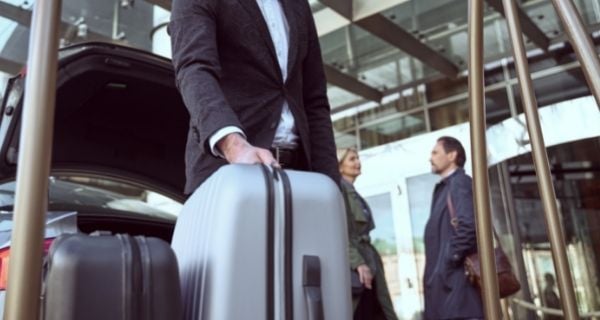 luggage being delivered where a senior is staying on a trip.