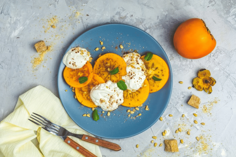 Winter fruit salad with persimmons and mascarpone cheese