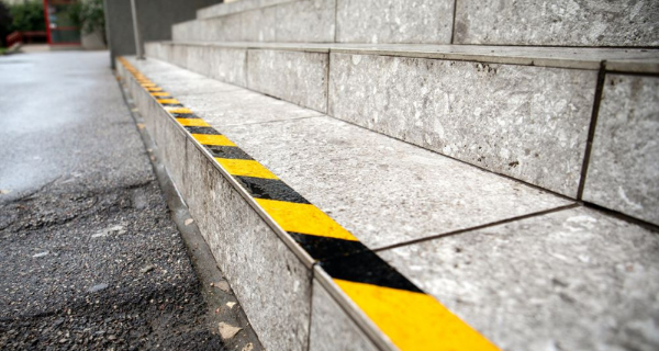 Yellow and black striped tape on edge of steps.