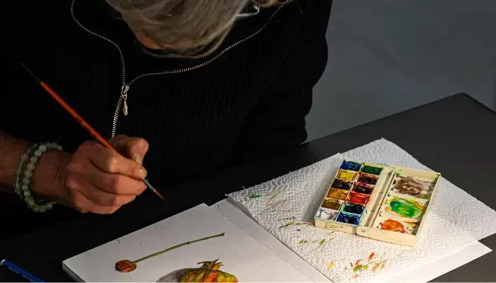 Person with dementia painting with watercolors