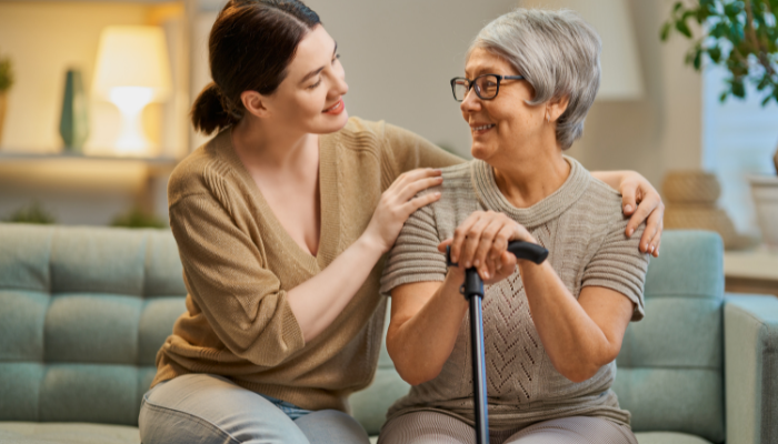 Mature woman speaking with her younger caregiver. 