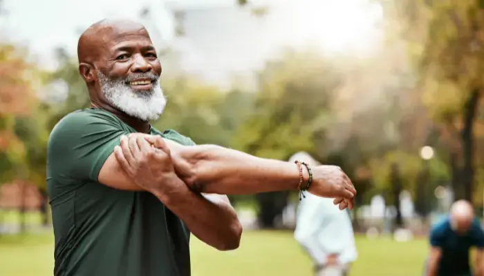 Active senior stretching before exercise