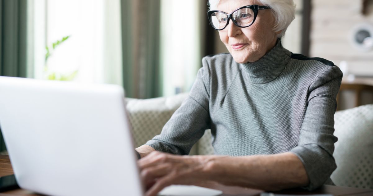 Mature adult using a laptop.